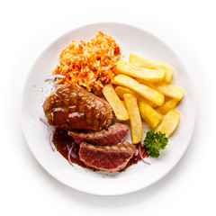     Grilled steak with french fries on white background 