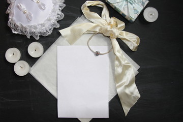 Wedding invitation with ribbons, candle, lace, charm and vellum. Mock-up for calligraphy or lettering