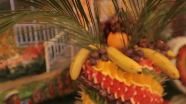 Fourchette sweet table with fruit on a background of colorful tapestry. wedding day