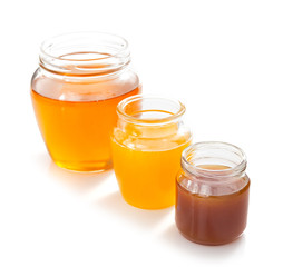 variety of honey in jar white background
