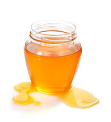 glass jar of honey and drop