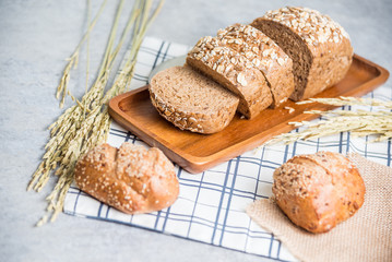 Homemade bread and wheat on table at kitchen
