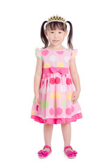 Little asian girl wearing pink color dress with crown smiling over white background