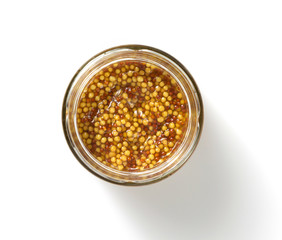 mustard sauce in plate on white background