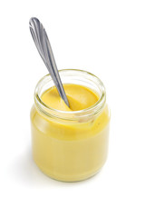 mustard sauce in jar on white