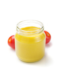 mustard sauce in jar on white