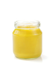 mustard sauce in jar on white