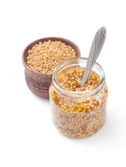 mustard dijon sauce in jar on white