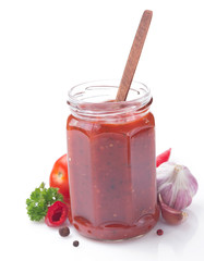 tomato sauce in jar on white background