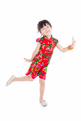 Little asian girl wearing red chinese traditional dress standing over white background