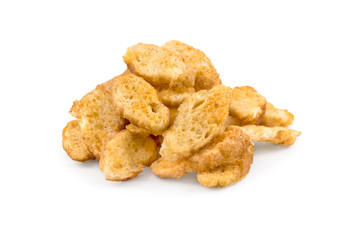 Heap of croutons from baguette with spices for beer on a white background.