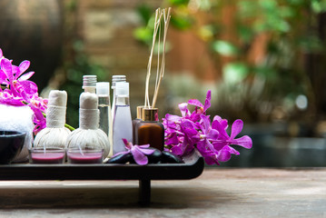 Thai Spa Treatments aroma therapy  salt and sugar scrub and rock massage with orchid flower on wooden white.  Healthy Concept. copy space,select and soft focus