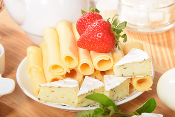 sweet strawberries on yellow and white pepper with cheese