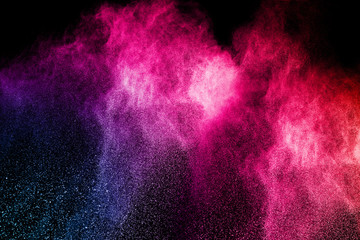 abstract color powder splatted on black background,Freeze motion of color powder exploding.