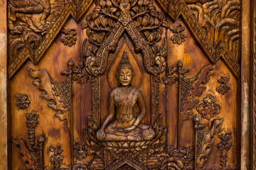 Wood carving of Buddhist history.