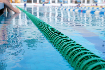 Obraz premium Dividers of paths in the big swimming pool