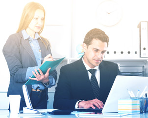 Businesswoman writing down tasks