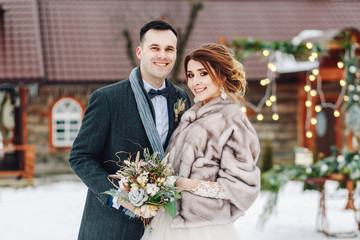 Winter wedding couple, bride and groom at their winter wedding day. Winter Wedding.
