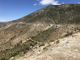 Dry and desert mountains in the countryside of Cephalonia or Kefalonia in Greece in a sunny day with blue sky.