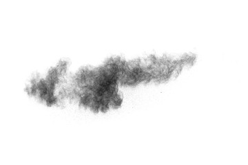 The particles of charcoal splatted on white background.