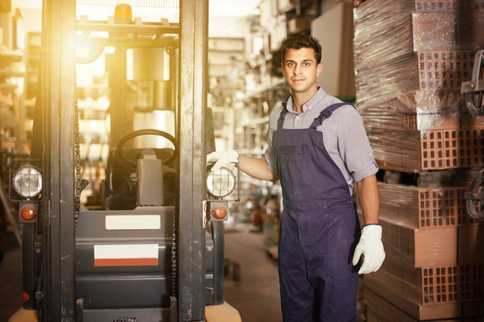 Portrait of adult sellerman in uniform in workplace