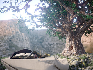 jewish holiday background with old book and olive tree landscape concept photo