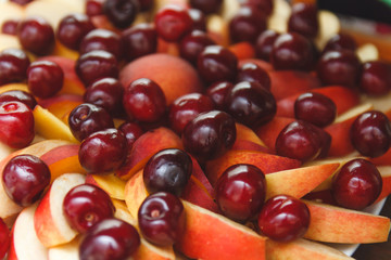 sliced Ripe apples and fresh cherries