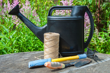garden tools: watering can, scoop, thread