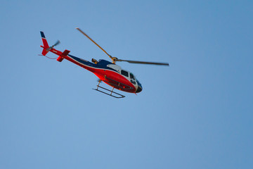 Fototapeta na wymiar helicopter in the blue sky