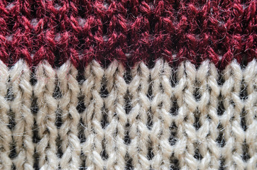 Knitting fabric texture closeup background - black, beige, burgundy color