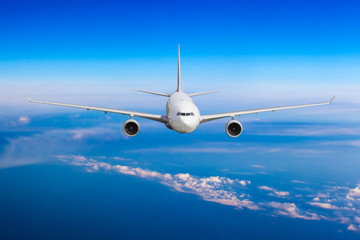 Naklejka premium aeroplane flying above clouds. Passenger Airliner flying