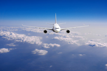 aeroplane flying above clouds. Passenger Airliner flying