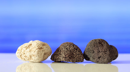 Pumice rocks on blue sea background