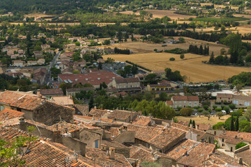 Fototapeta na wymiar The picturesque view on the tile roofs of the houses of Fayence village in Cote d’Azur, Provence, France