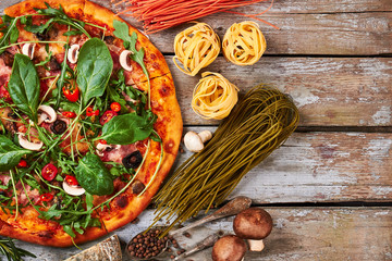 Baked pizza, dry pasta, top view.