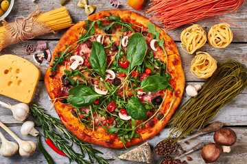 Colorful spaghetti, freshly baked pizza.