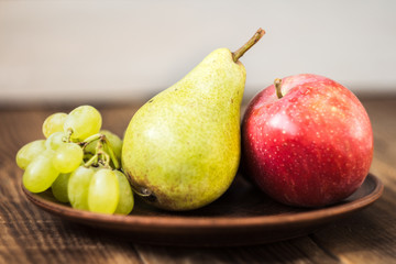 fruit plate grapes apple plum pear
