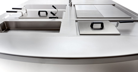 the cooktop of a professional kitchen