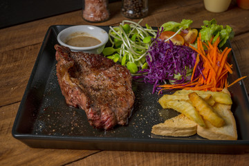 Buffalo meat steak on wood