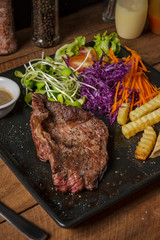 Buffalo meat steak on wood