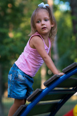 Fototapeta na wymiar Girl child in the playground
