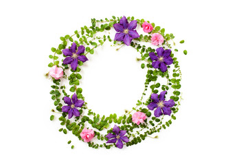 Holiday floral frame with flowers, branches and leaves on white background. flat lay, top view