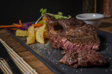 Buffalo meat steak on wood