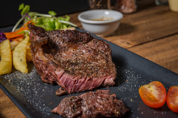 Buffalo meat steak on wood