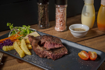 Buffalo meat steak on wood