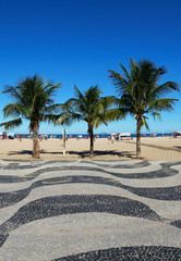 Copacabana and the famous geometric boardwalk and coconut trees on the beach
