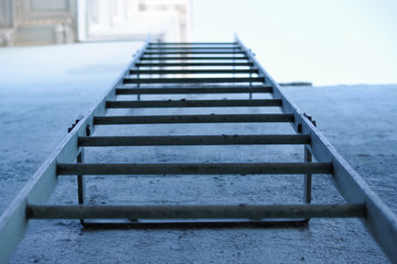 Fototapeta premium Ladder Up Building from Below Perspective