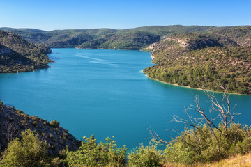 Obraz na płótnie Canvas Lake Esparron (lac Esparron de Verdon), one of the five lakes of the Verdon Gorge National Park. Beautiful daytime landscape, popular tourist destination in Provence, Alpes-de-Haute-Provence, France