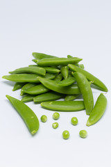 Green sugar snap peas isolated on white background.