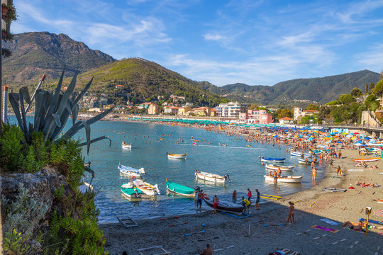LEVANTO, ITALY, AUGUST 15, 2017 - Landscape of Levanto, La  Spezia province near 5 Terre, the beach and promenade full of people in summertime.